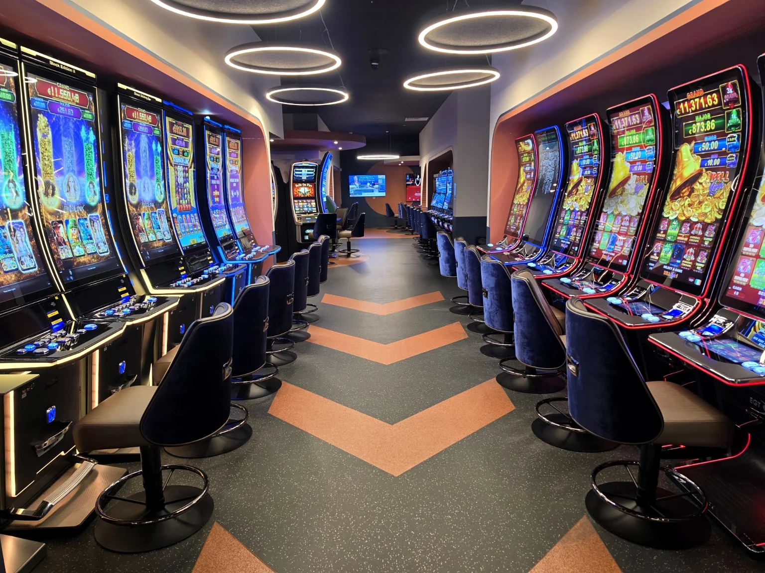 Refurbished Adelaide gaming floor with colourful machines and comfortable seats