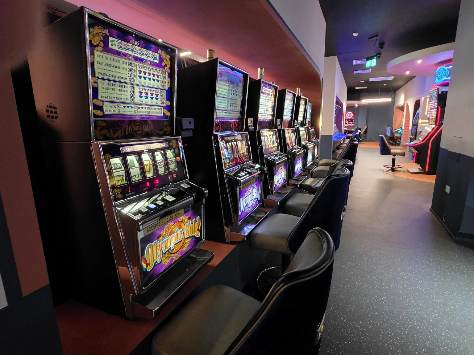 Traditional machines and comfortable chairs in an Adelaide Casino aisle